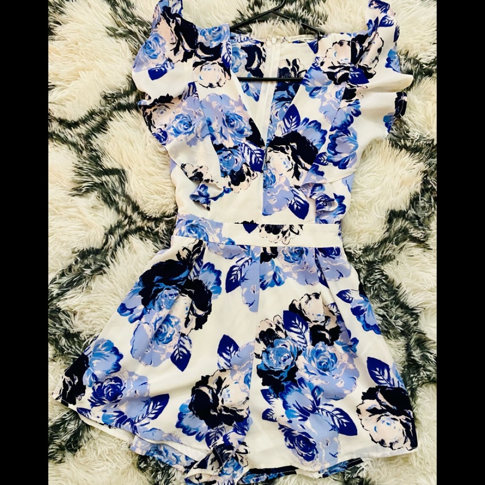 Beautiful ruffle shoulder floral romper